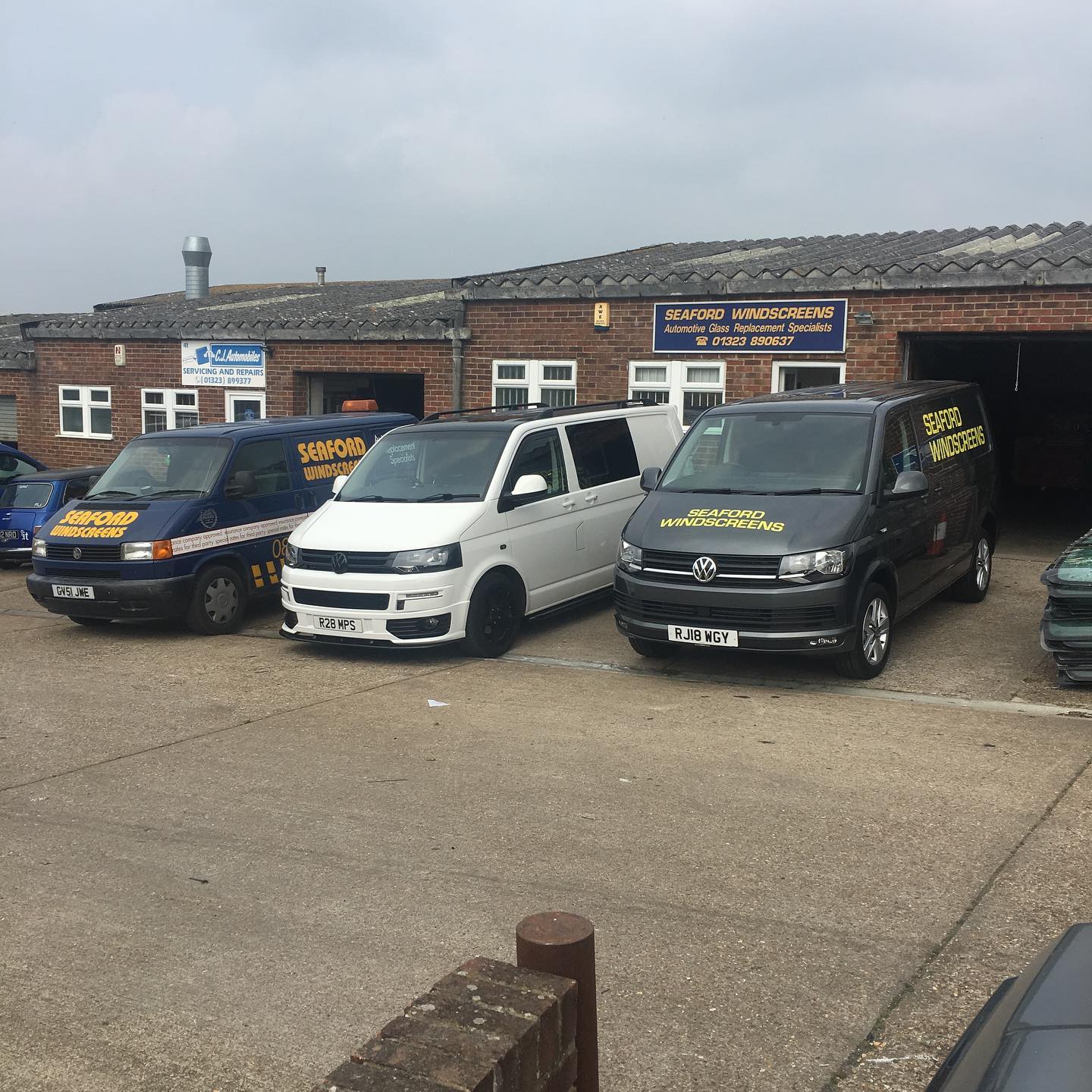 A group of Seaford Windscreens vans parked outside the Seaford Windscreens workshop.
